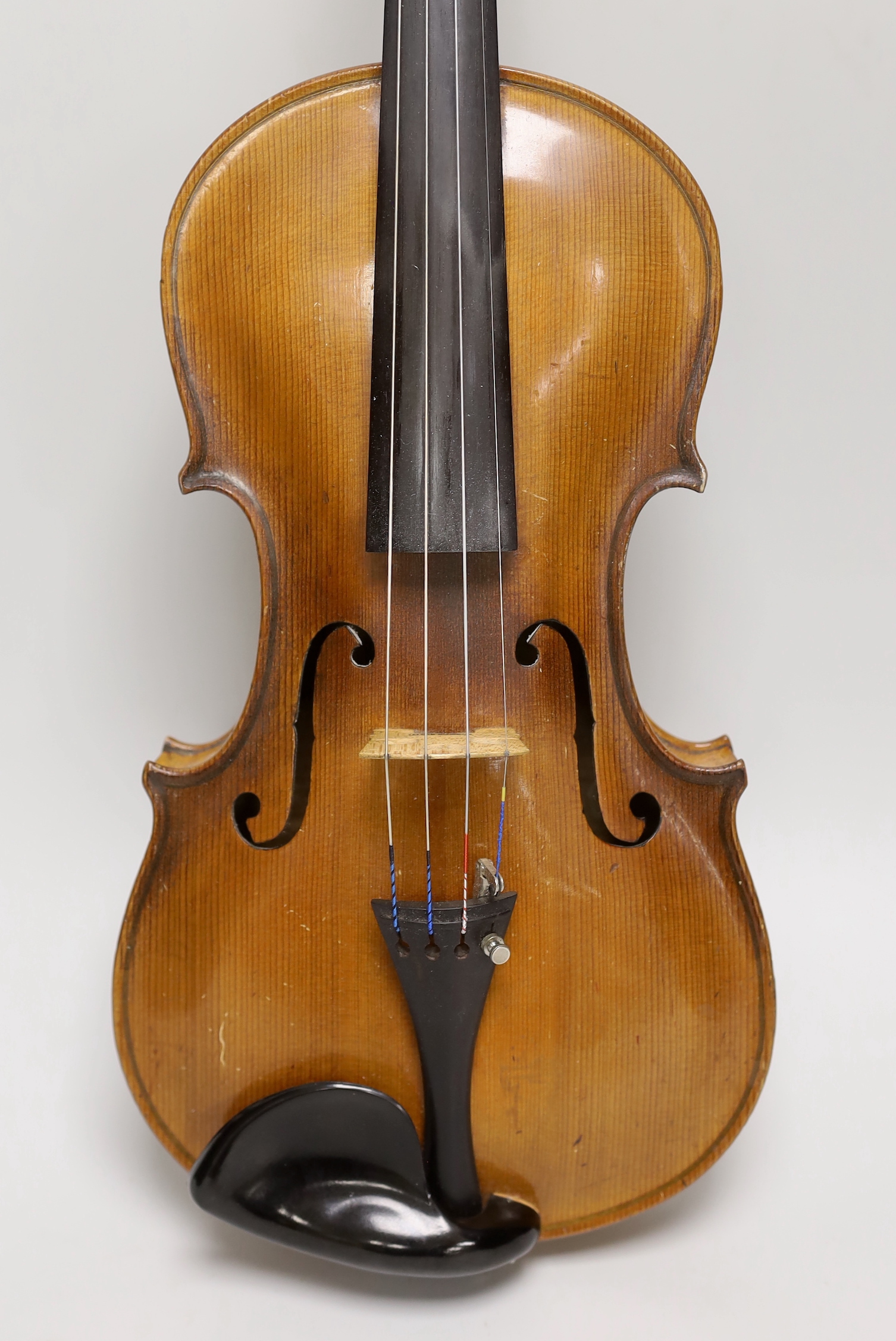Likely German, a cased violin, late 19th/early 20th century, the back 14 inches in length